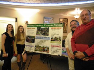 Westfield State students Pollyanna Pyshnyak of Westfield and Sydney Demarais of Haverill explain their public gardens concept to James Homan of Westfield on Weekends and city councilor Ralph J. Figy. (Photo by Amy Porter)