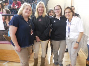 Carrie Salzer, adjustment counselor, Karen Bashow, network specialist, and guidance counselors Kristin Puleo and Marylina Asselin dressed in khakis and polo shirts to honor Jack Dougherty on Thursday. (Photo by Amy Porter)