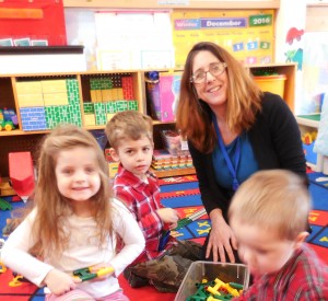 Susan LeBarron, Hilltown Family Center coordinator, playing with Elayna Dowd of Middlefield and Noah Monfette of Huntington. (Photo by Amy Porter)