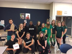 SAAD members helped run the penny wars competition and handed out donuts to the seventh graders as part of their celebration. (Photo by Greg Fitzpatrick)