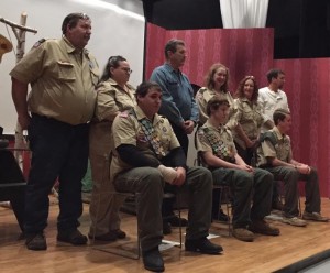 The three Eagle Scout honorees sit with their parents standing behind them. (Photo by Greg Fitzpatrick)