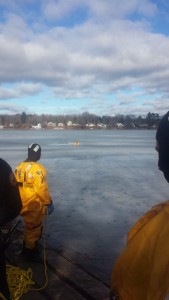 A rescuer is in the icy Hampton Ponds water during ice rescue training last week. (Photo by: Dan Desrochers)