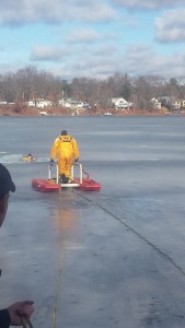 A rescuer goes out on the ice rescue sled to help a victim during an ice rescue training last week. (Photo by: Dan Desrochers)