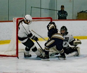 Longmeadow-Westfield's Kayla Brown (30) goalie makes her first save of the game against Needham Sunday at Amelia Park Arena. (Photo by Lynn Boscher)