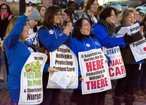 A group of nurses from Baystate Noble Hospital cheer on one of the speakers at a demonstration on Westfield Park Square  (Photo by Lynn Boscher)