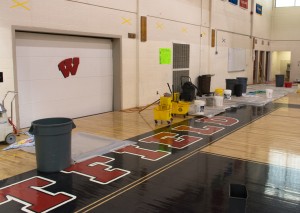 Buckets, mops and other items are seen in this photo from Wednesday January 4 as part of the cleanup of areas of the gymnasium roof leak (Photo by Lynn Boscher)