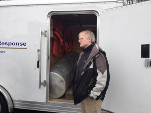 Dave Slowick speaks about oil spill response with some of his equipment that is used in the background. (Photo by Greg Fitzpatrick)