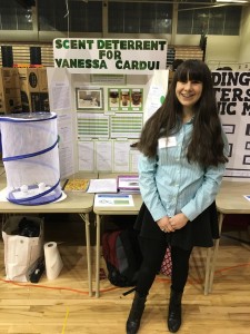 Cassidy Pawul poses next to her Scent Deterrent science project last year.