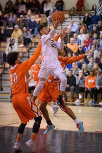Westfield's Rodney Bernard floats through the Agawam defense in a West Division 1 boys' basketball opener Monday night in the Whip City. (Photo by Marc St. Onge)