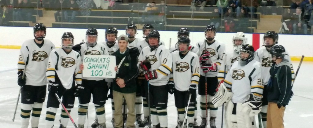 The St. Mary boys' ice hockey team honors senior center Shaun Gezotis for scoring his 100th point.