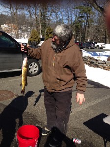 North Pond supporter Bill Alaimo was seen weighing the fish that participants caught at the ice fishing derby. (Photo from Dennis Clark)