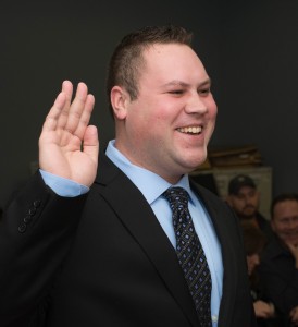 Zachary D. Kareta smiles as he is being sworn in by the Westfield Fire Commission as one of the two newest firefighter-paramedics for the city of Westfield