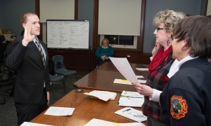 Matthew B. Potter takes oath from city clerk Karen Fanion during his swearing in as one of Westfield's two newest firefighters