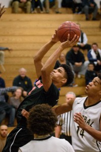 Westfield's Javi Santos takes aim with a fadeaway against Central in a tournament quarterfinal Thursday night in Springfield. (Photo by Marc St. Onge)