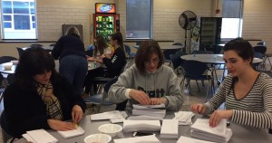 Parents, volunteers, students, and former students all helped mail envelopes to Southwick residents. (Photo by Greg Fitzpatrick)