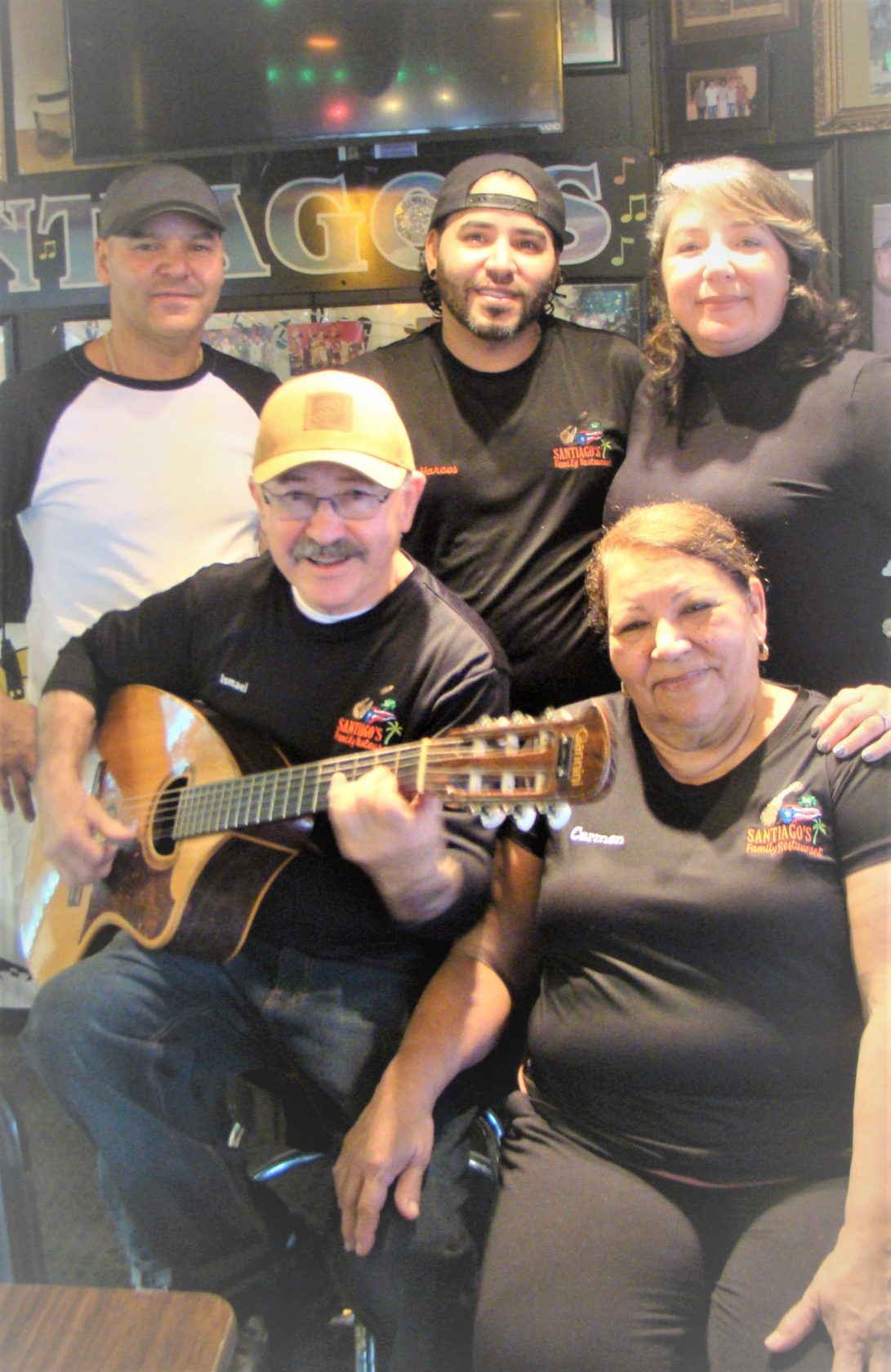 Rear (L-R) Ismael, Jr., Marcos, Carmen Alexa. (Front) Ismael and Carmen Santiago